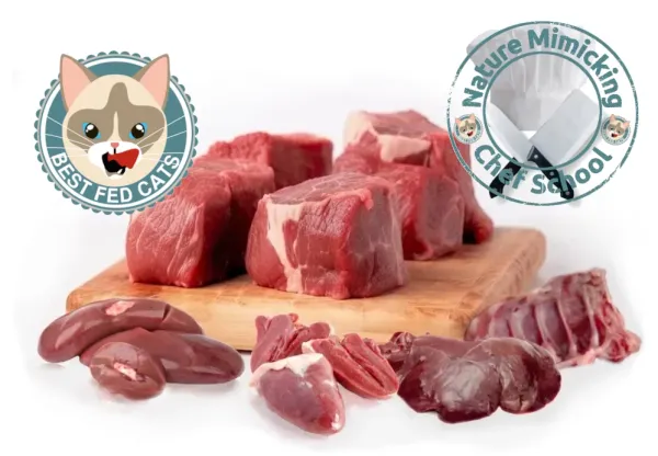 Best Fed Cats - Image of fresh, raw meat and organs on a wood chopping block with the Nature Mimicking Chef School emblem